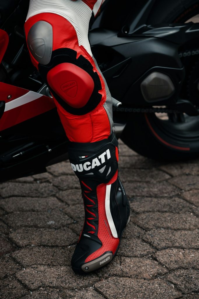 a-close-up-of-a-person-wearing-red-and-white-shoes-mma7sdqnrnc