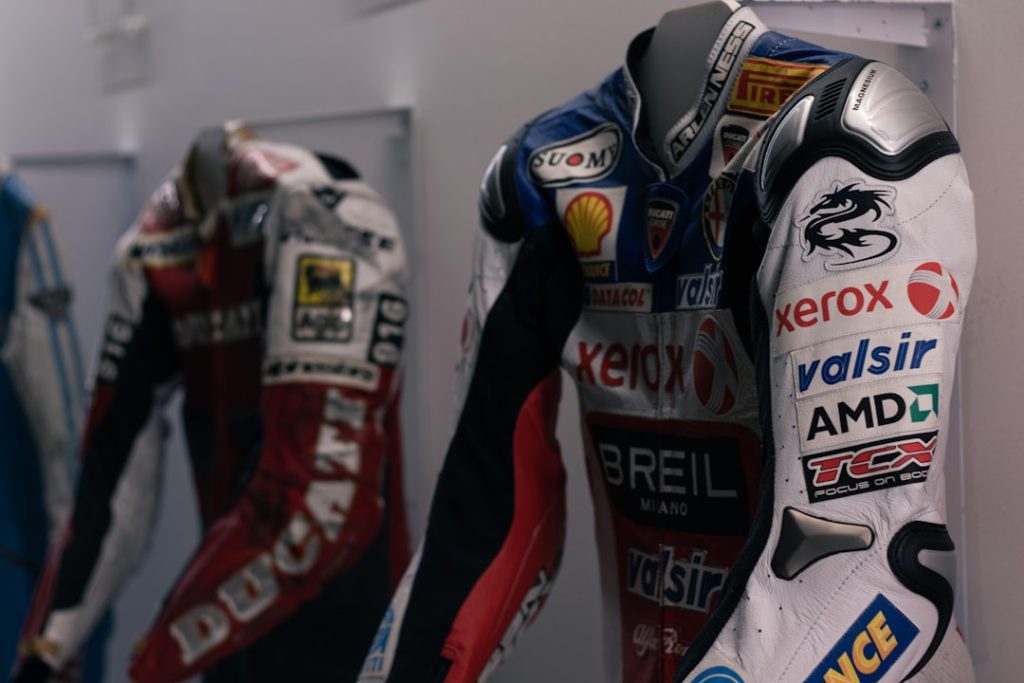 a-number-of-motorcyclists-racing-suits-on-display-yhclq-vynjo